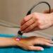 hand-low-level-laser-therapy-promote-healing-soft-tissues-infrared-treatment-hand-manage-pain-numbness-tingling-doing-laser-therapy-improve-blood-flow-immune-system_342250426.jpg